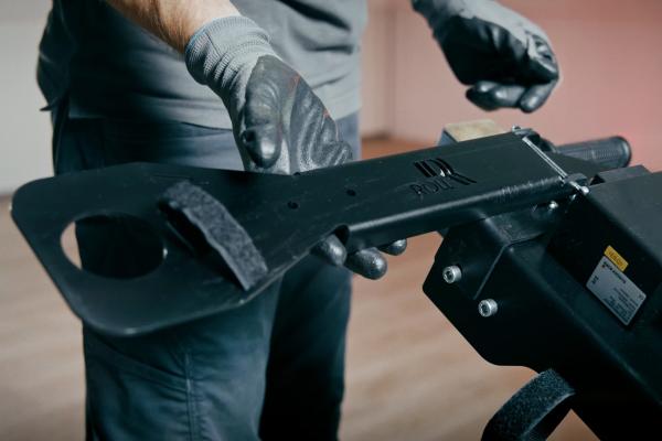 The hose and cable holder is a useful accessory for our floor grinding machines RO-300 and RO-400 to fix the suction hose and connection cable to the drawbar of the machine.